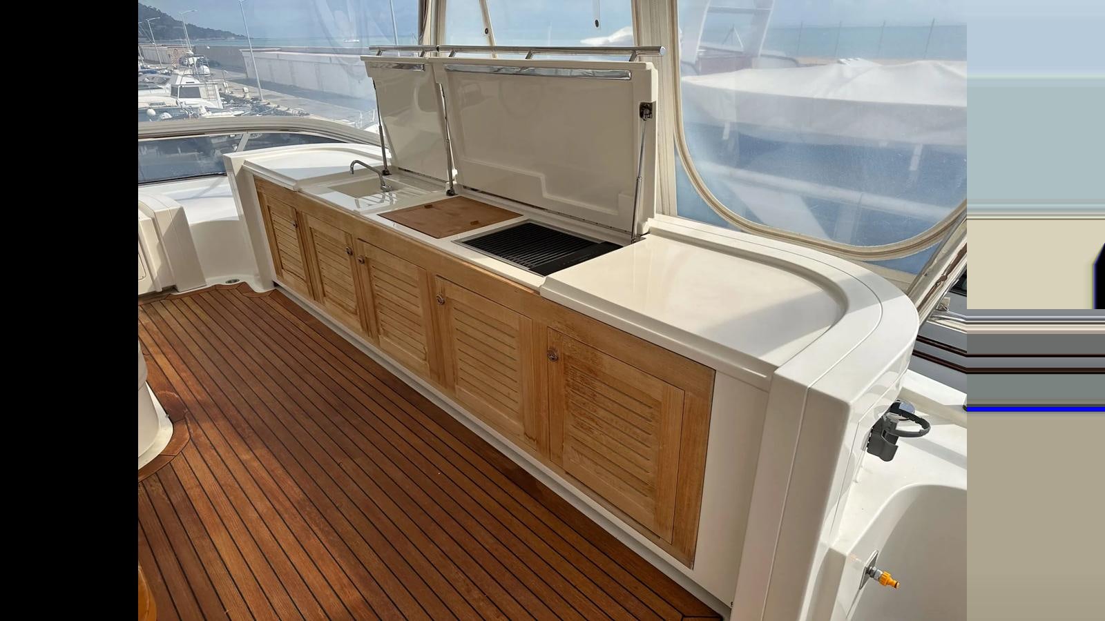 a kitchen with a large window aboard CHARISMA II Yacht for Sale