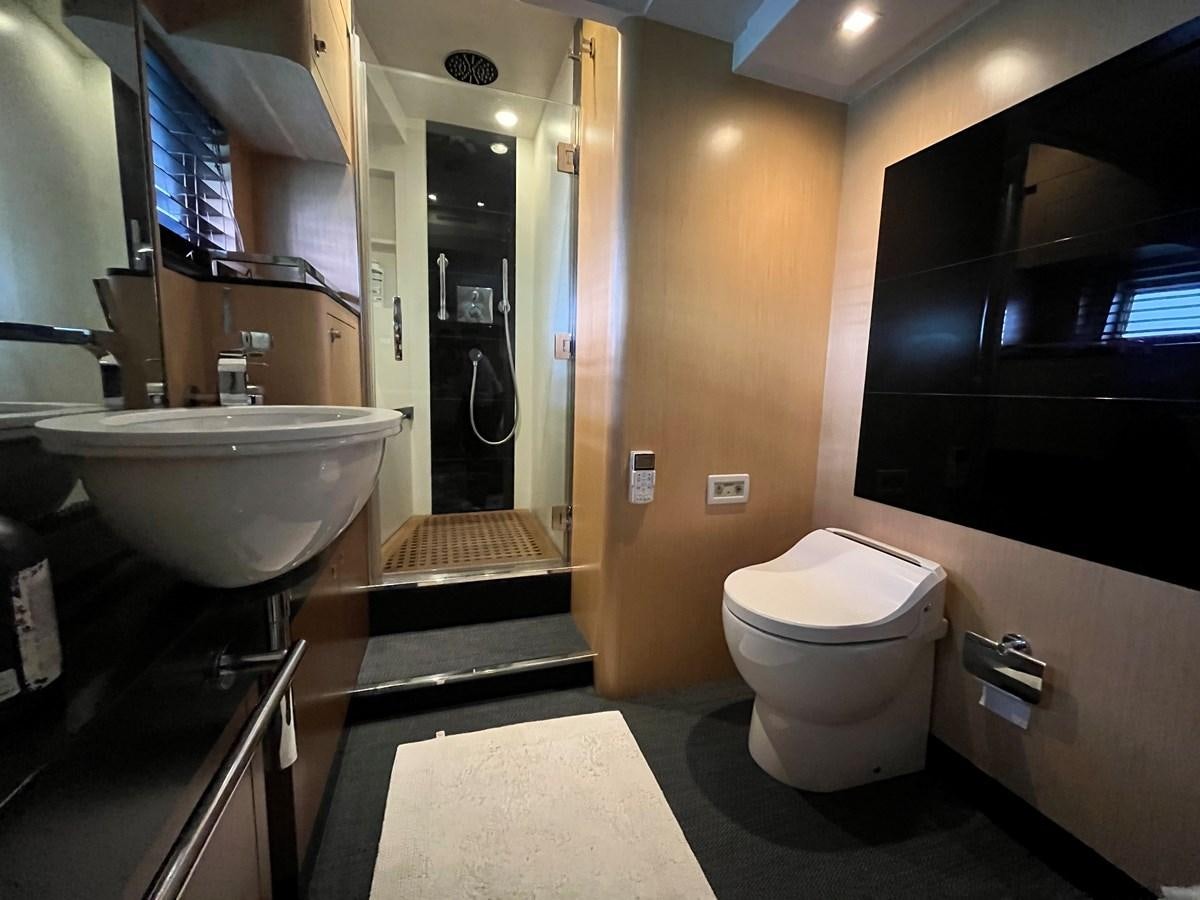 a bathroom with a sink toilet and a bathtub aboard CHARISMA II Yacht for Sale