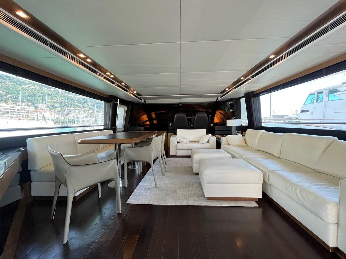 a living room with a large window aboard CHARISMA II Yacht for Sale