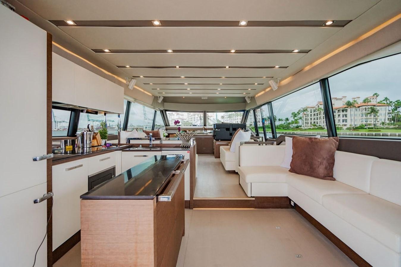 a room with a couch and a table aboard YACHTOOMA Yacht for Sale