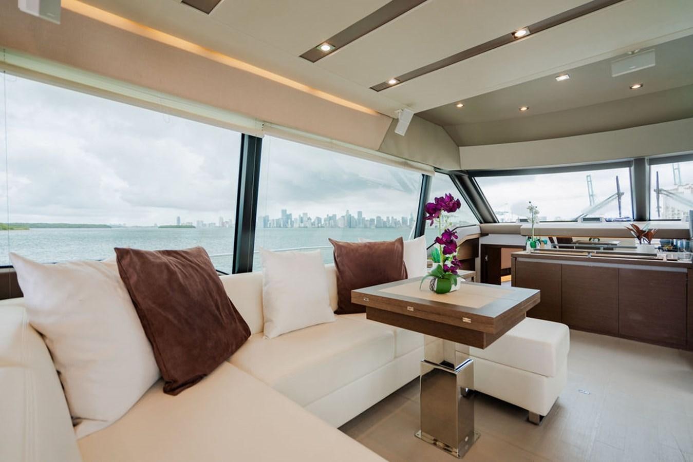 a living room with a large window aboard YACHTOOMA Yacht for Sale