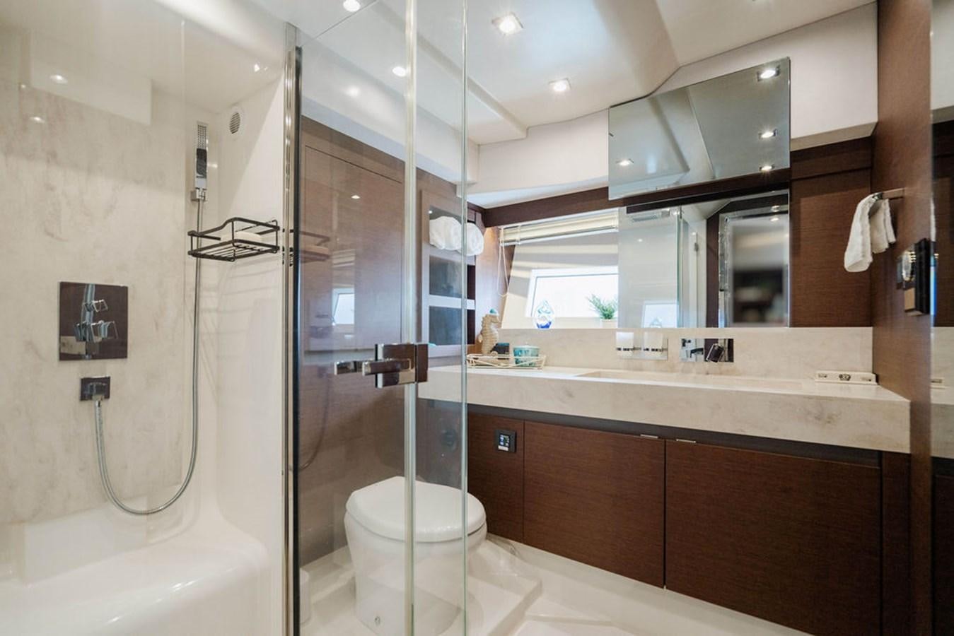 a bathroom with a glass shower aboard YACHTOOMA Yacht for Sale