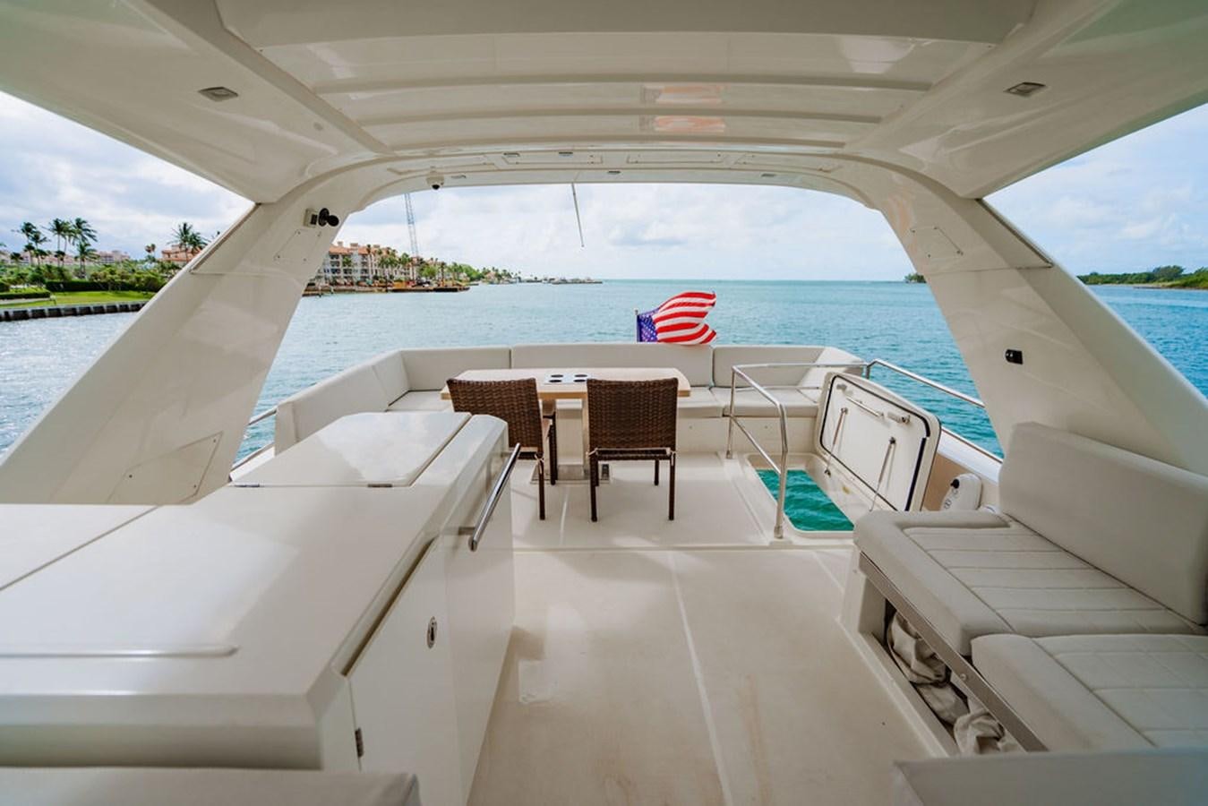 a boat with chairs and tables aboard YACHTOOMA Yacht for Sale