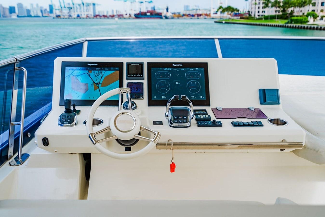 a white boat with a black and white interior aboard YACHTOOMA Yacht for Sale
