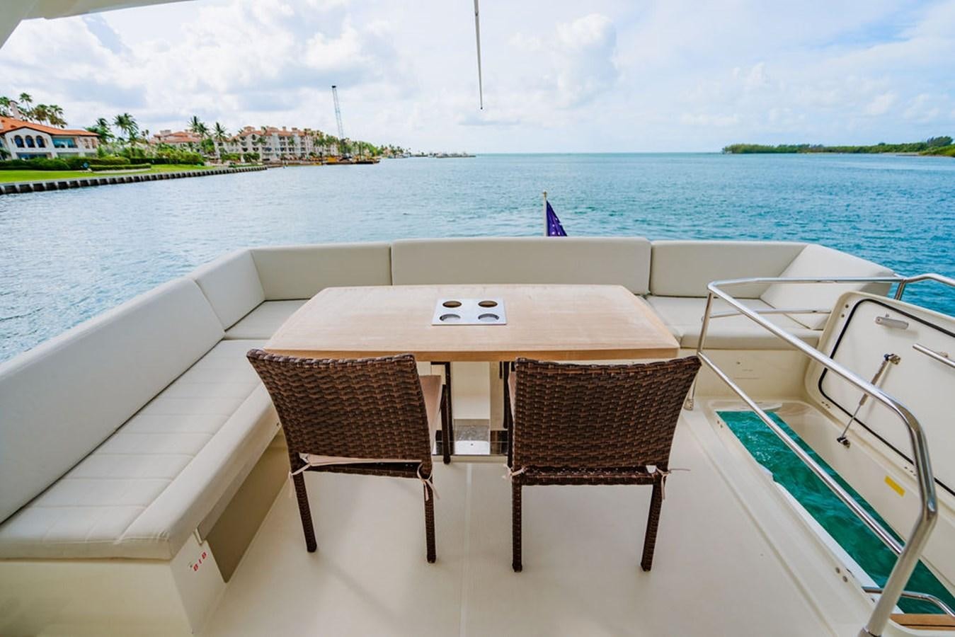 a table and chairs on a boat aboard YACHTOOMA Yacht for Sale