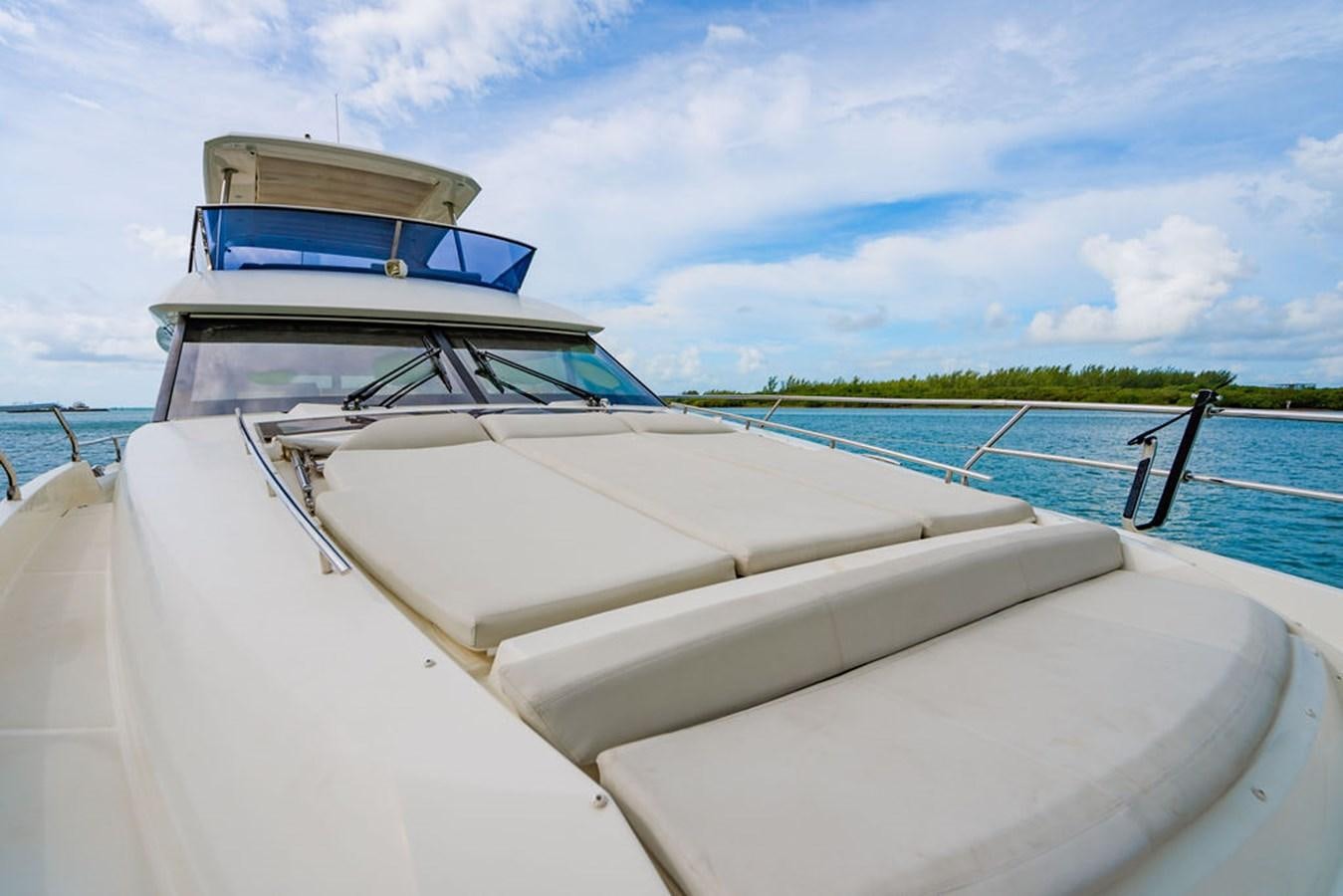 a white boat on a body of water aboard YACHTOOMA Yacht for Sale