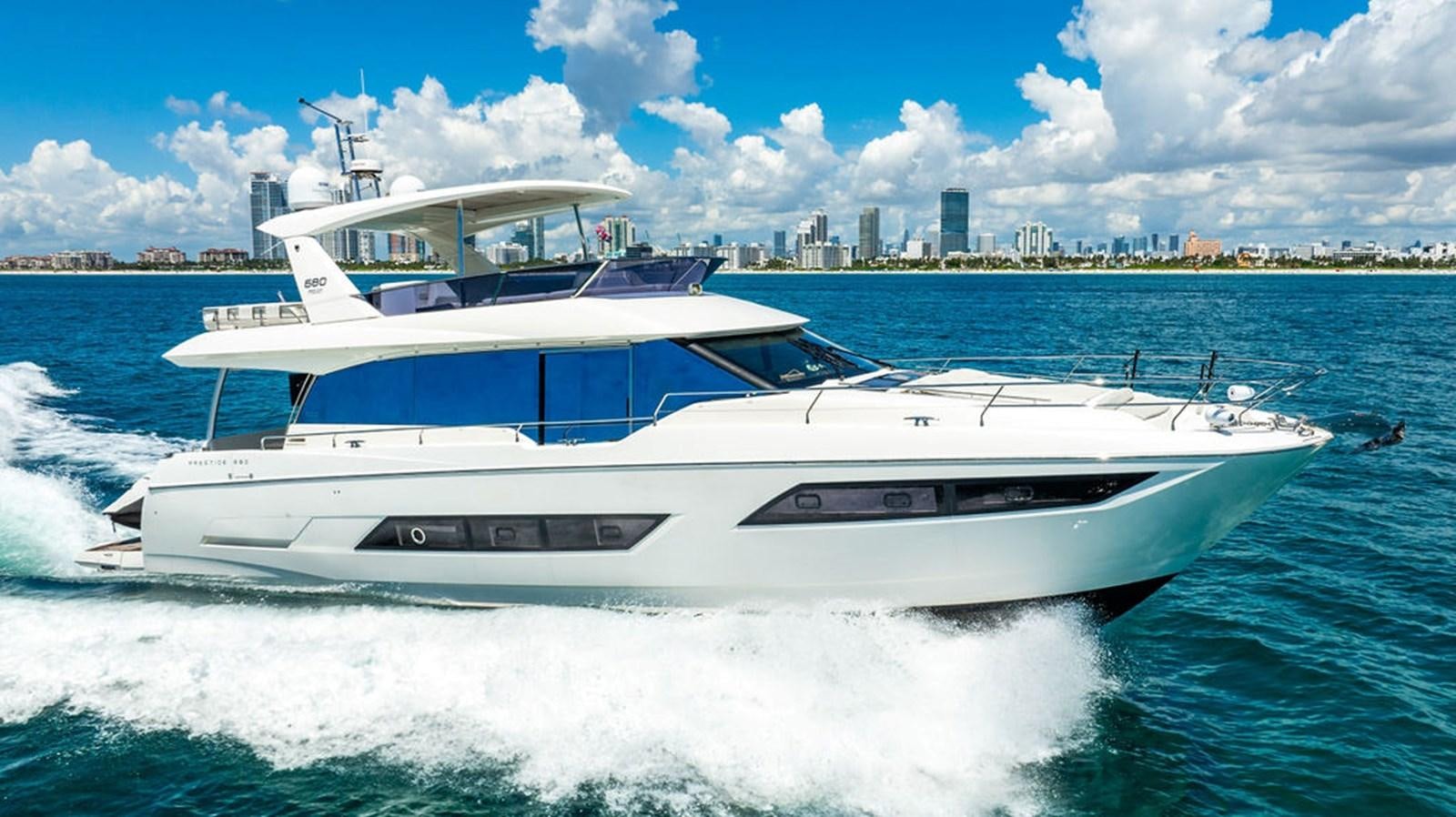 a white yacht on the water aboard YACHTOOMA Yacht for Sale