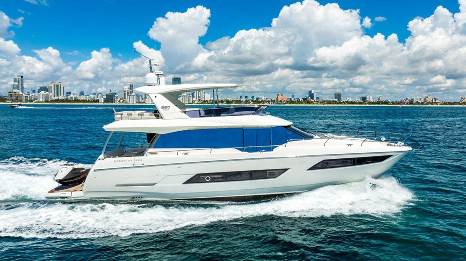 a white yacht on the water aboard YACHTOOMA Yacht for Sale