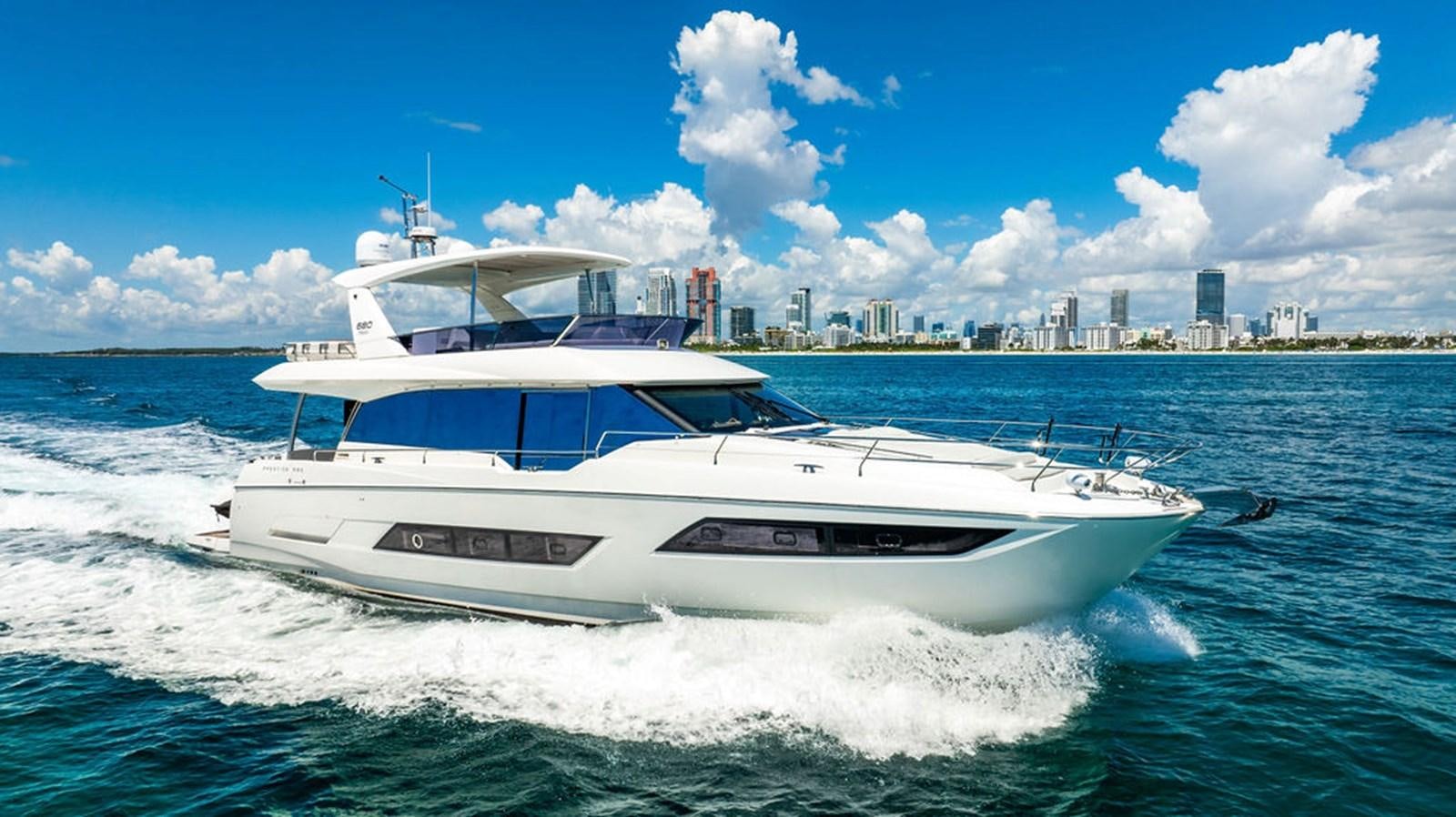 a white yacht on the water aboard YACHTOOMA Yacht for Sale