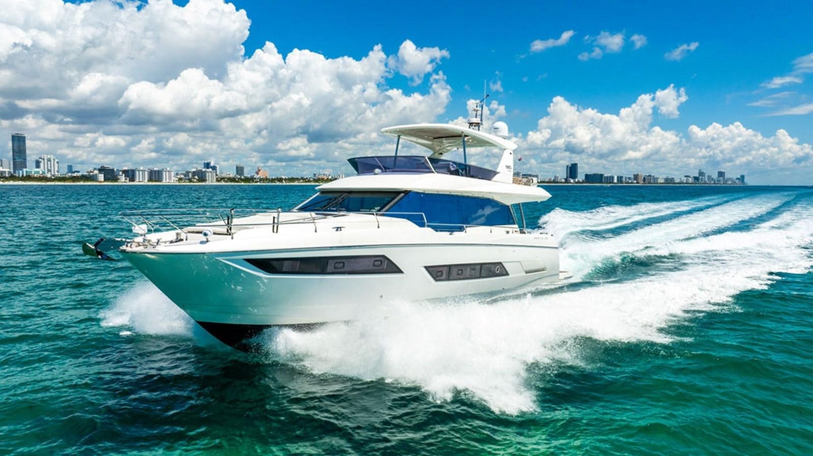 a white yacht on the water aboard YACHTOOMA Yacht for Sale