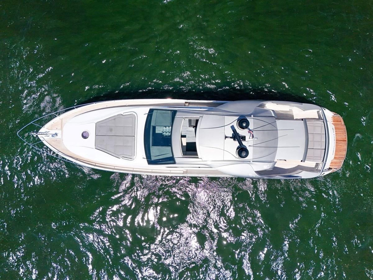 a white car with a logo on it aboard SANS SOUCI VIII Yacht for Sale
