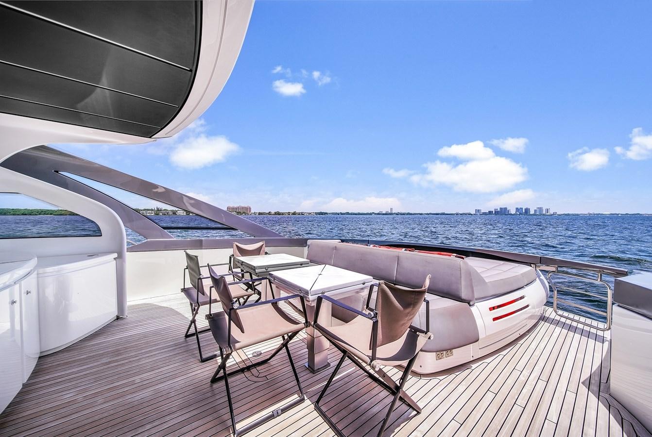 a deck with chairs and tables on it aboard SANS SOUCI VIII Yacht for Sale