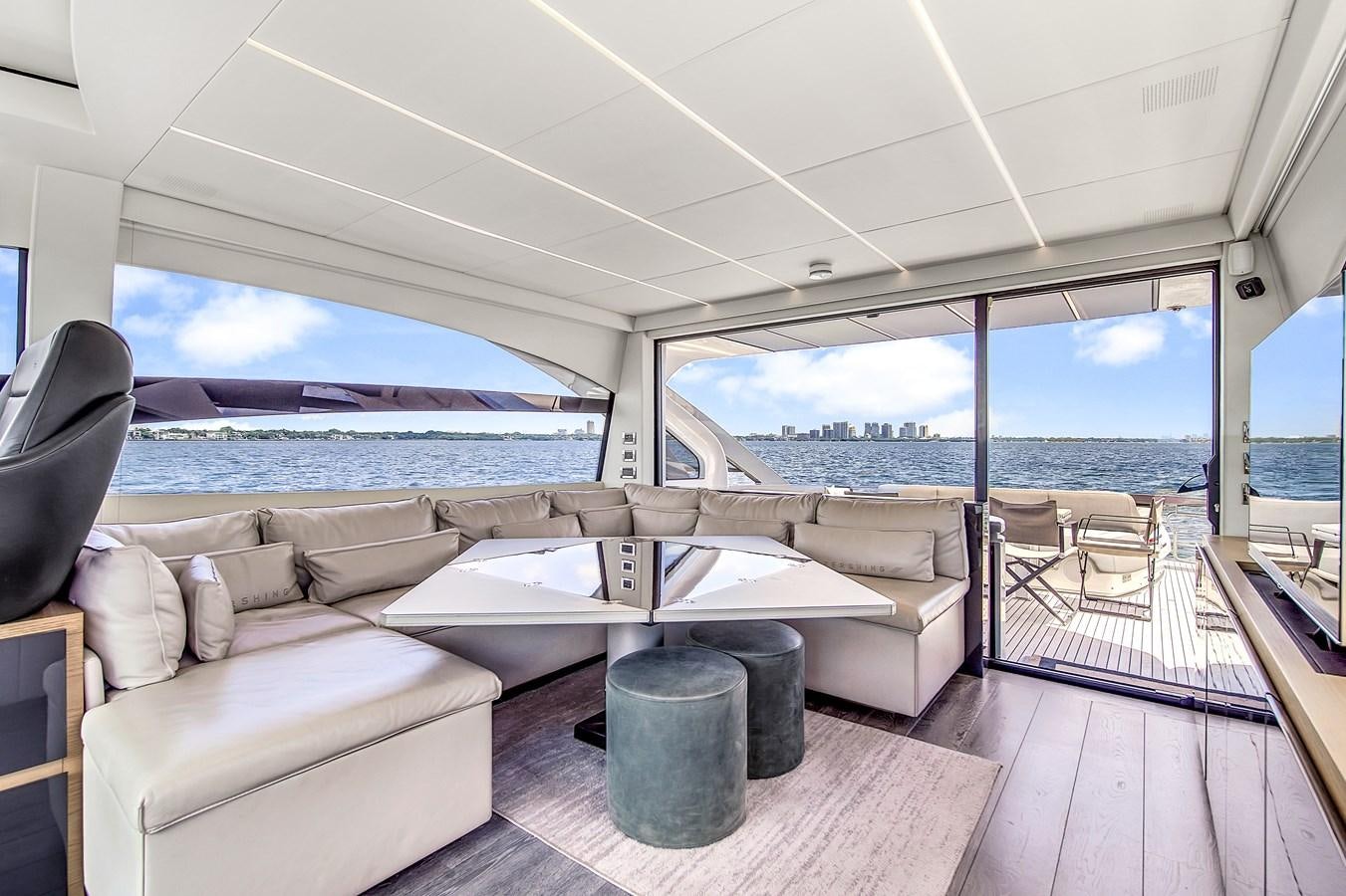 a living room with a large window aboard SANS SOUCI VIII Yacht for Sale
