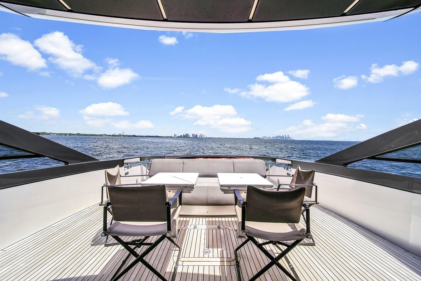 a deck with chairs and a body of water in the background aboard SANS SOUCI VIII Yacht for Sale