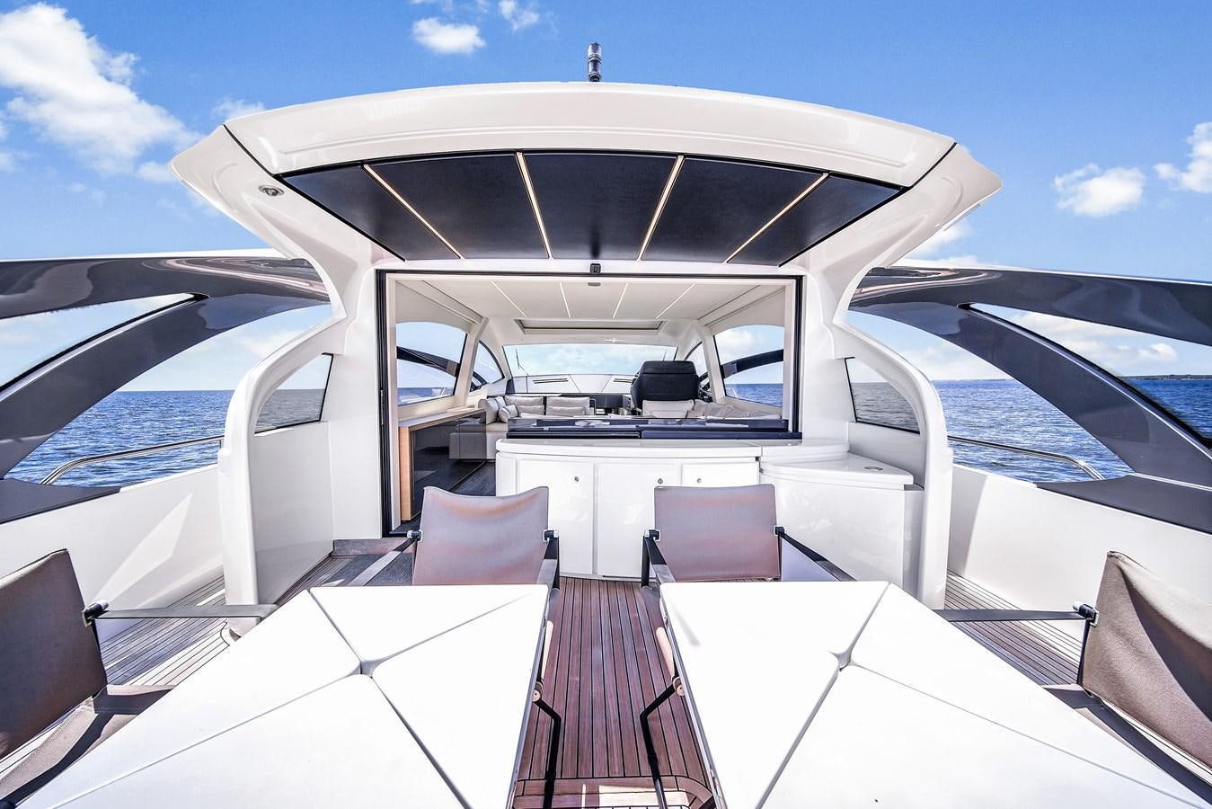 a boat with a table and chairs on it aboard SANS SOUCI VIII Yacht for Sale