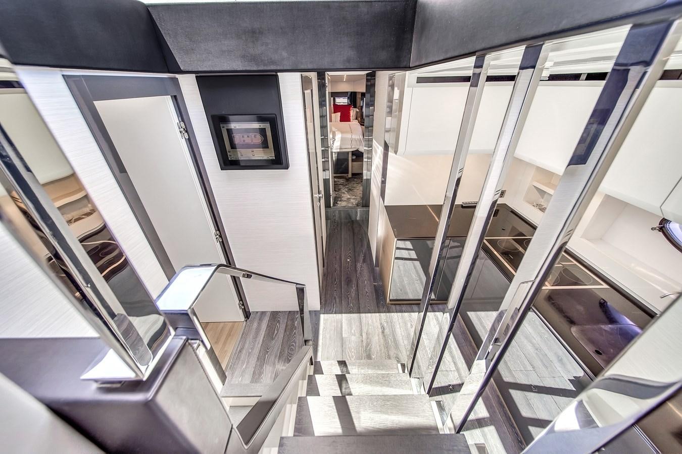 a set of stairs leading to a room with a window aboard SANS SOUCI VIII Yacht for Sale