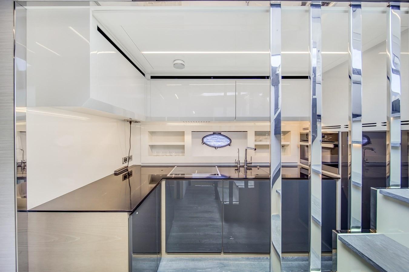 a large room with a large glass wall and a round window aboard SANS SOUCI VIII Yacht for Sale