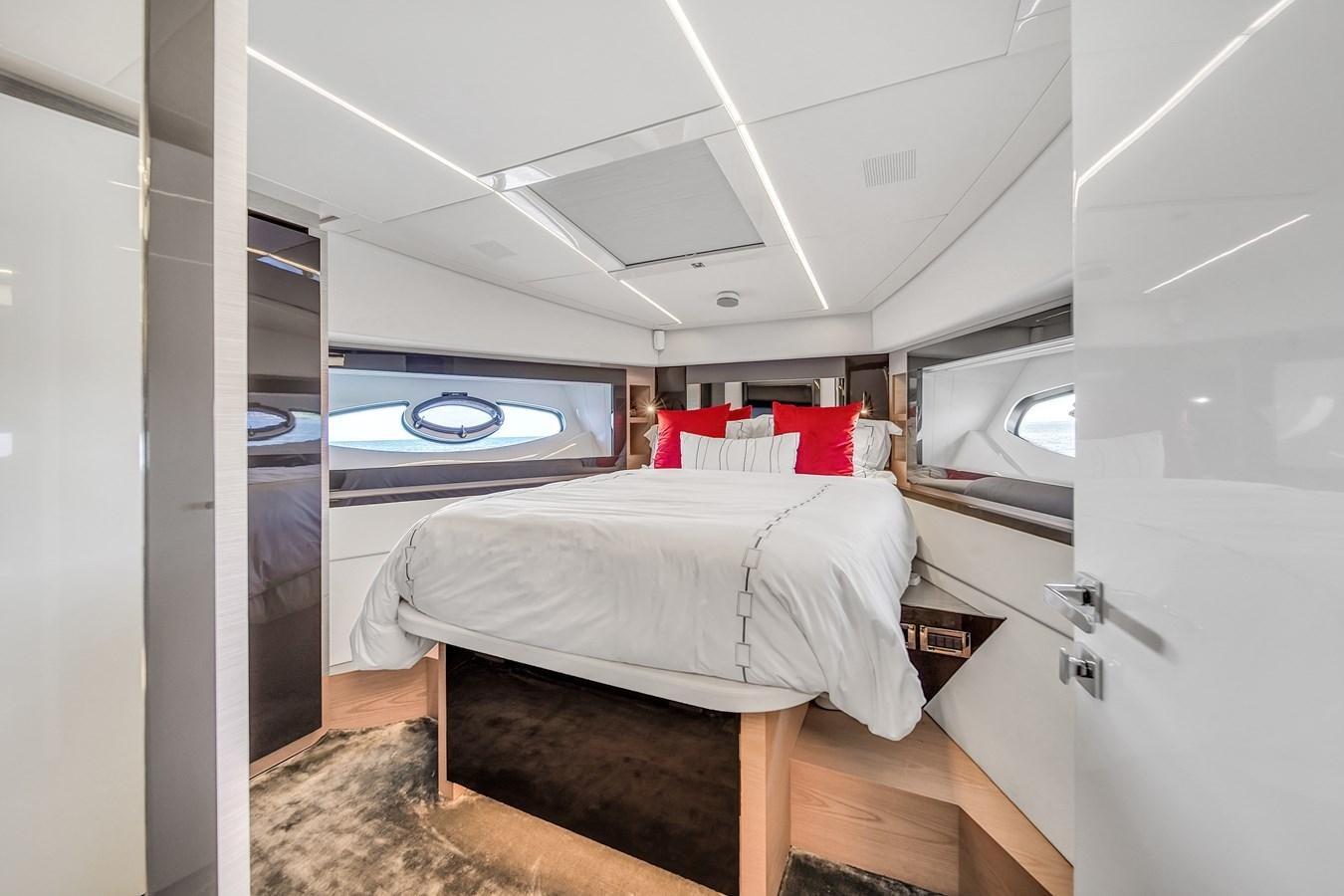 a room with a bed and a window aboard SANS SOUCI VIII Yacht for Sale