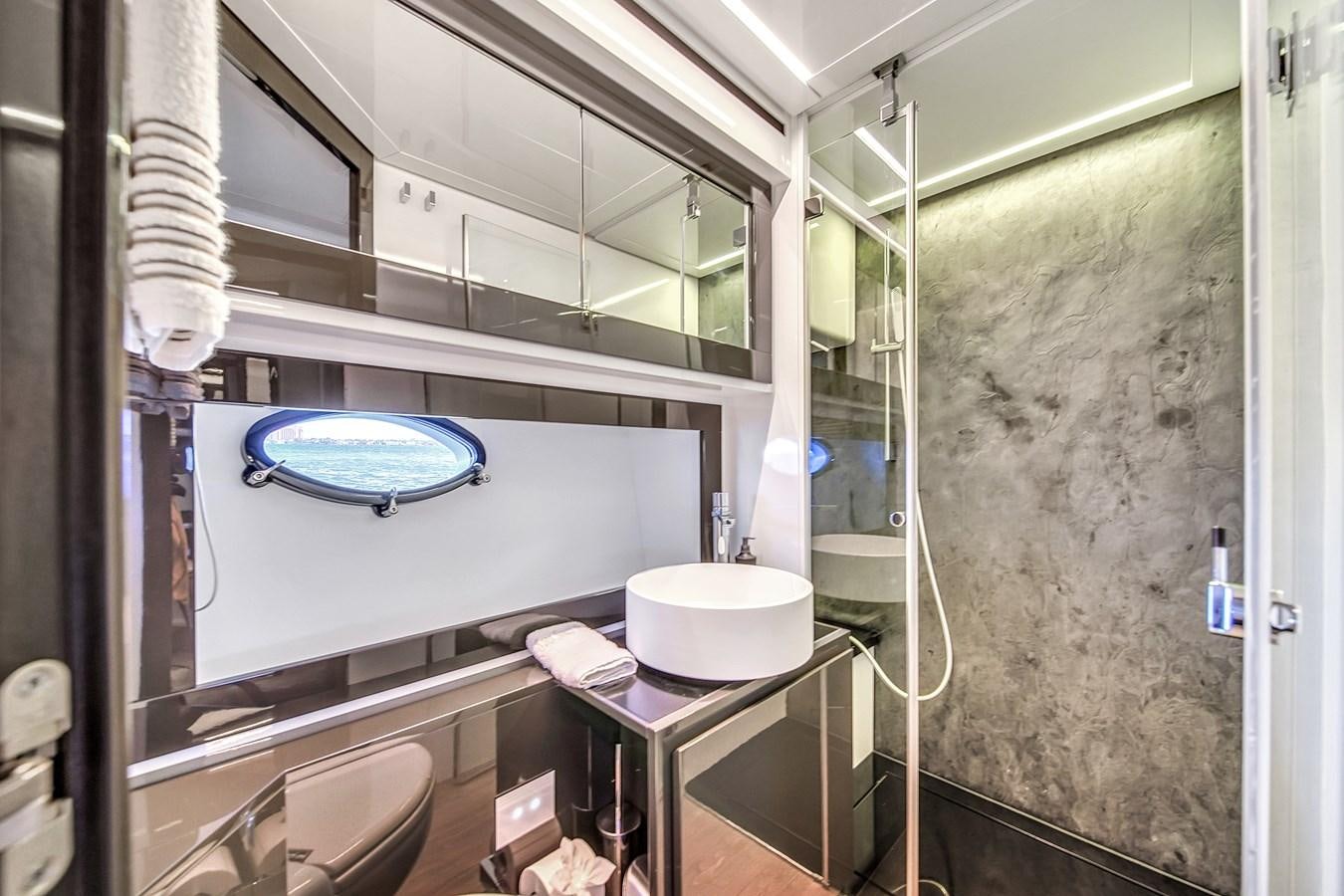 a bathroom with a glass shower aboard SANS SOUCI VIII Yacht for Sale