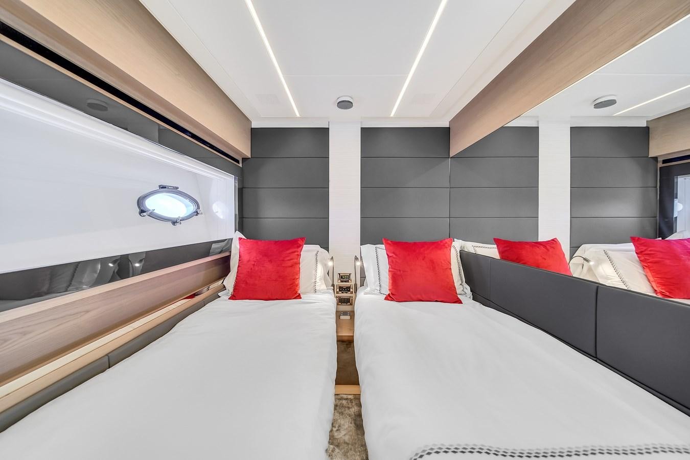 a room with a bed and a window aboard SANS SOUCI VIII Yacht for Sale