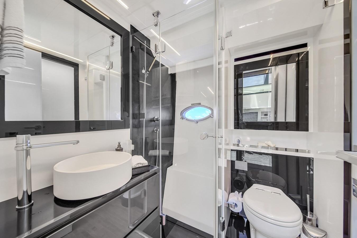 a bathroom with a glass shower aboard SANS SOUCI VIII Yacht for Sale
