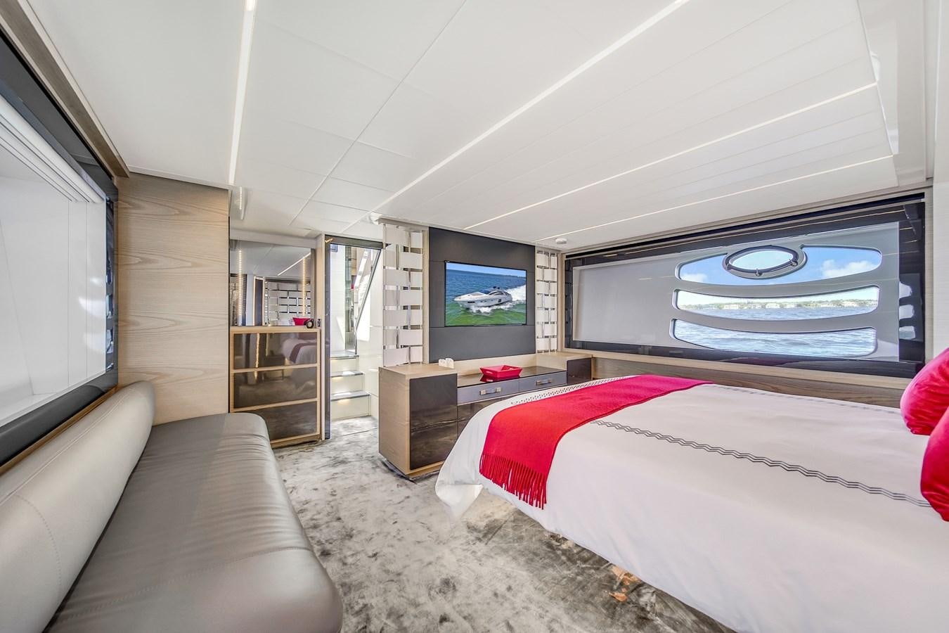 a bedroom with a bed and a tv aboard SANS SOUCI VIII Yacht for Sale