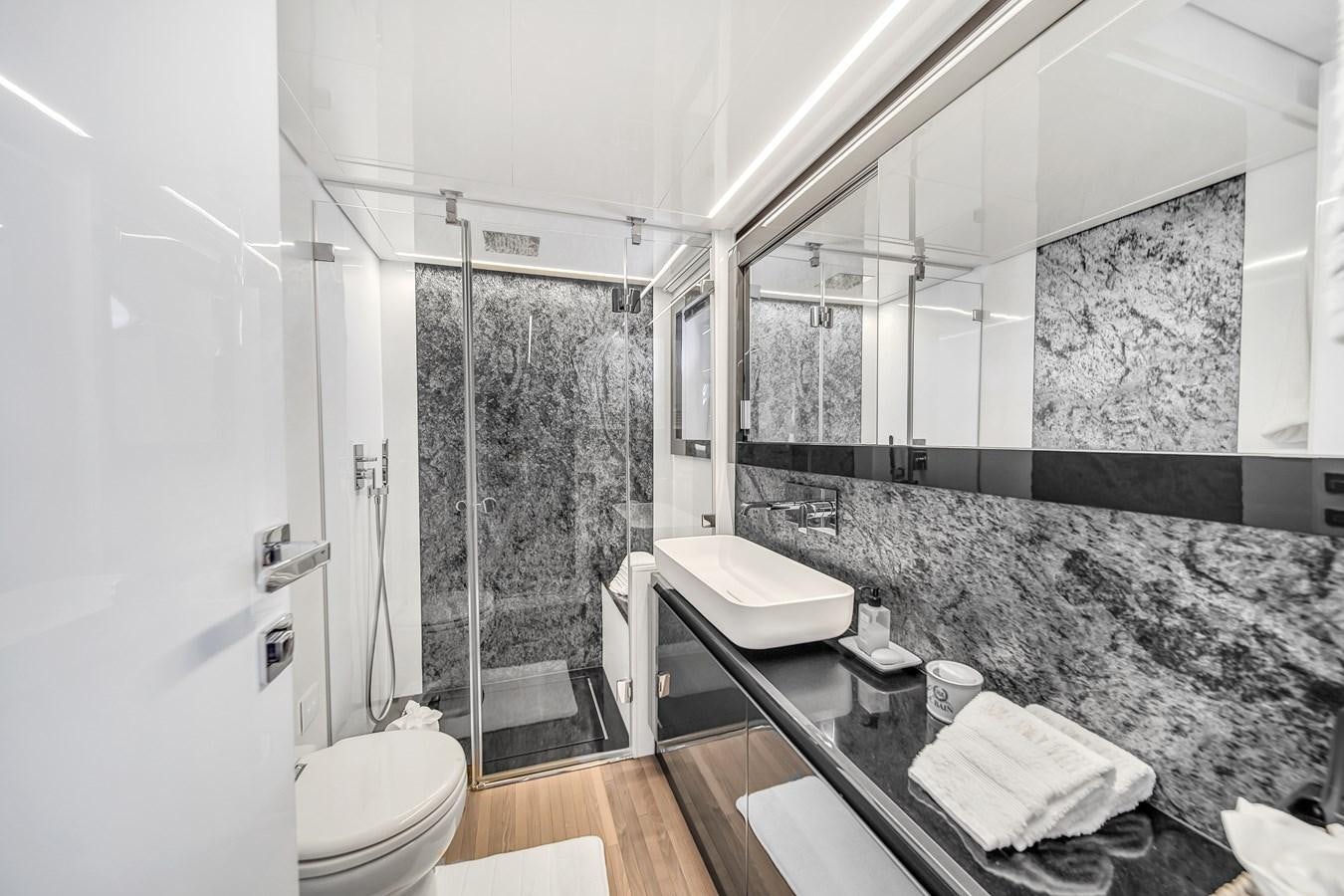 a bathroom with a large mirror aboard SANS SOUCI VIII Yacht for Sale