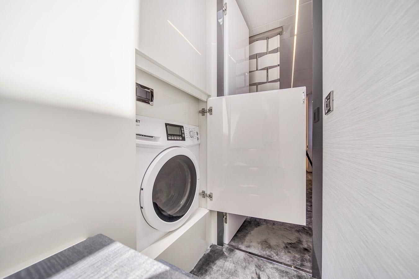 a washer and dryer in a room aboard SANS SOUCI VIII Yacht for Sale