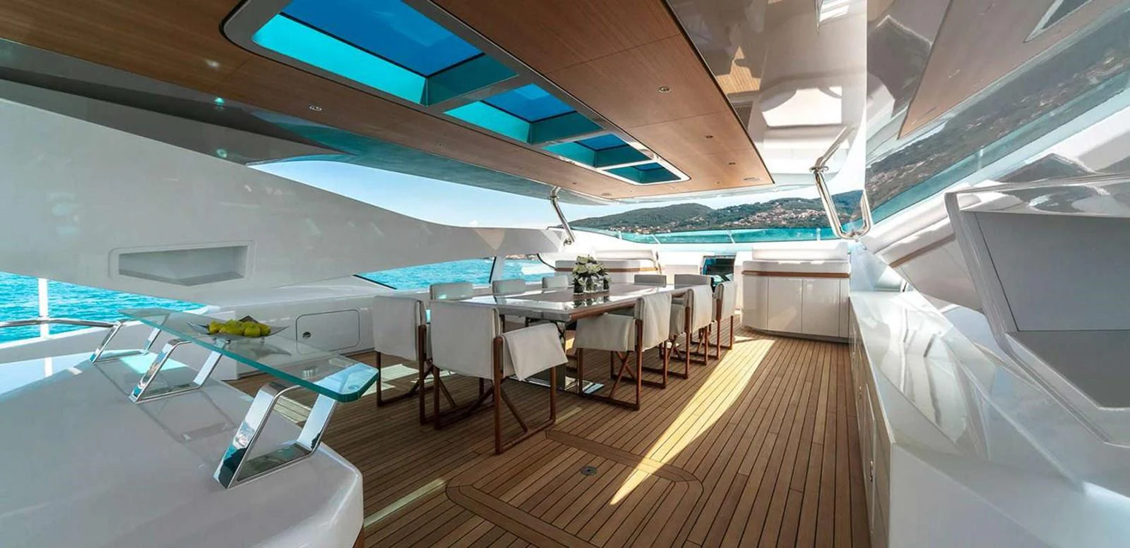 a room with a table and chairs aboard EL LEON Yacht for Sale
