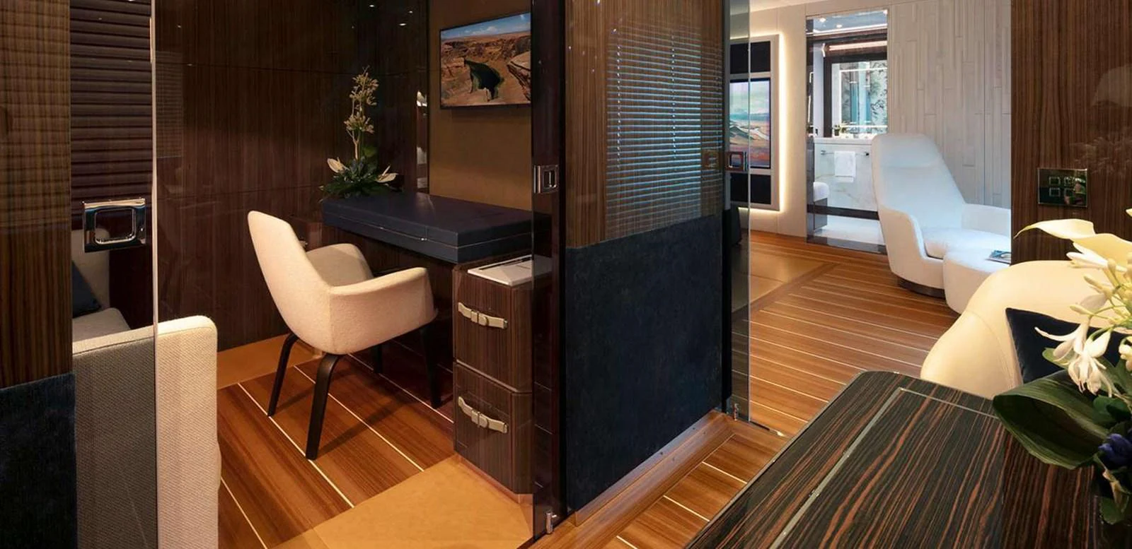 a room with a desk and chairs aboard EL LEON Yacht for Sale