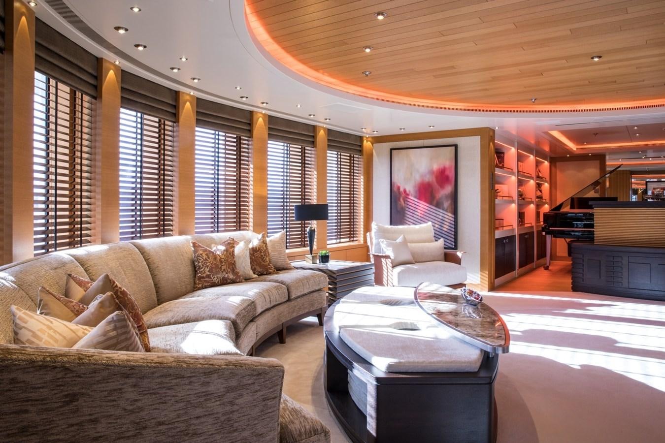 a living room with a large window aboard CAIPIRINHA Yacht for Sale