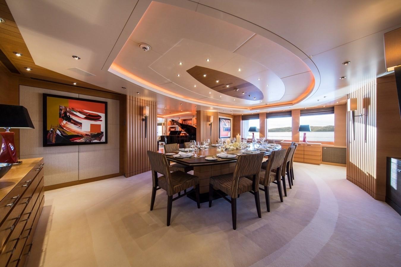 a large dining room with a large table and chairs aboard CAIPIRINHA Yacht for Sale