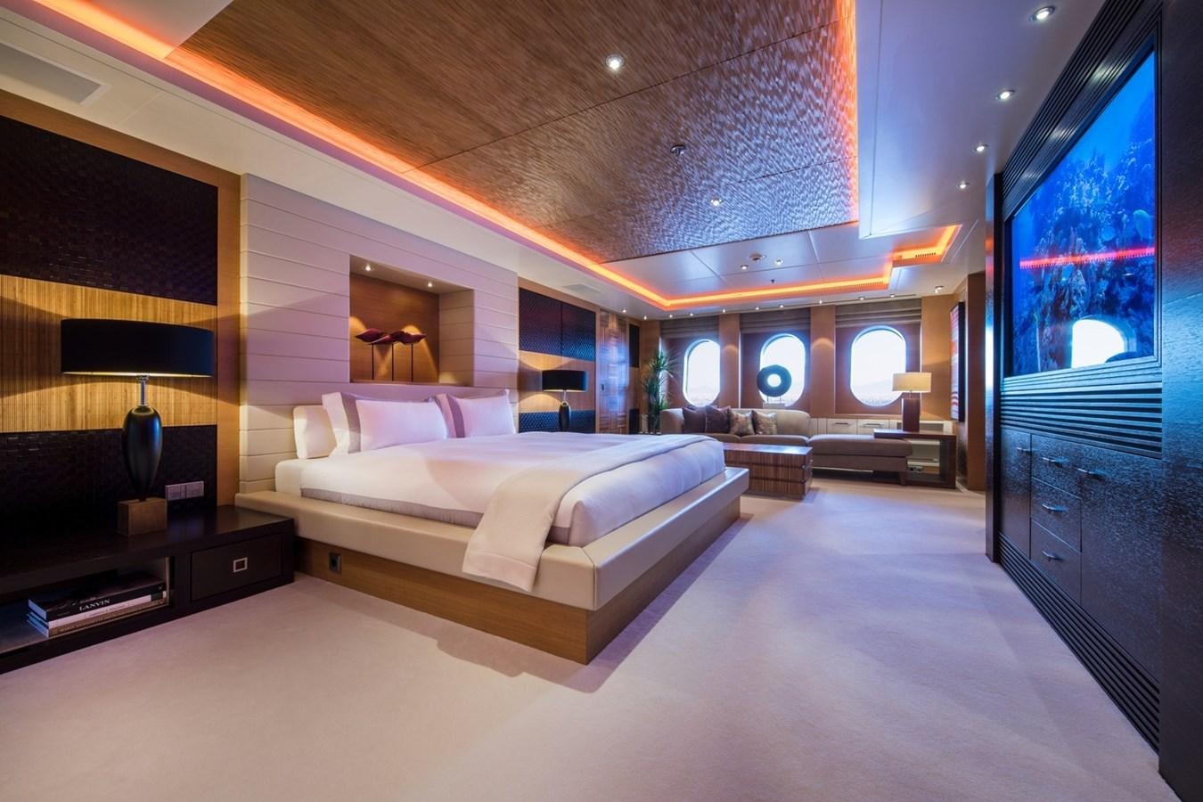 a room with a bed and a large mirror aboard CAIPIRINHA Yacht for Sale