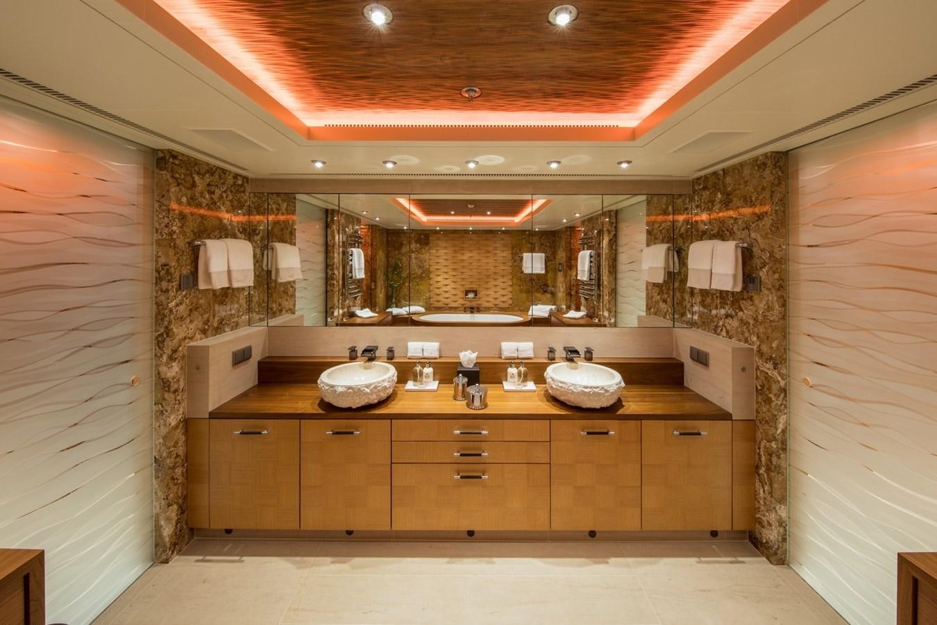 a bathroom with wooden cabinets aboard CAIPIRINHA Yacht for Sale
