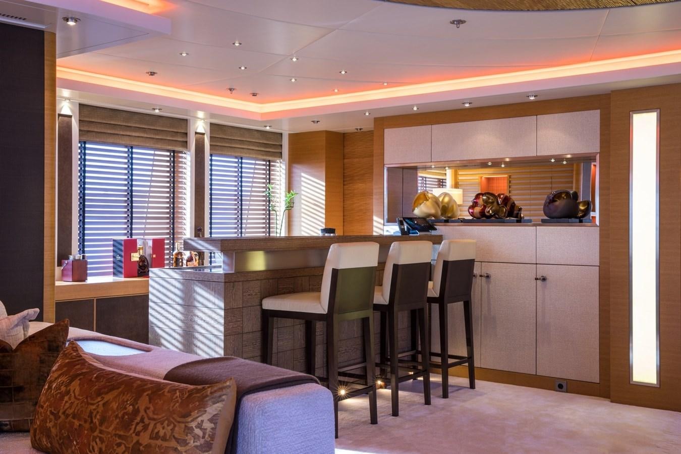 a kitchen with a table and chairs aboard CAIPIRINHA Yacht for Sale