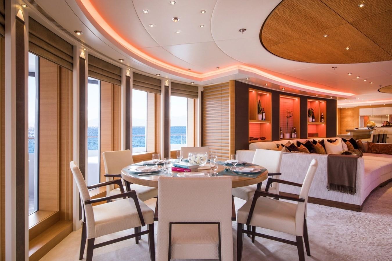 a room with a table and chairs aboard CAIPIRINHA Yacht for Sale