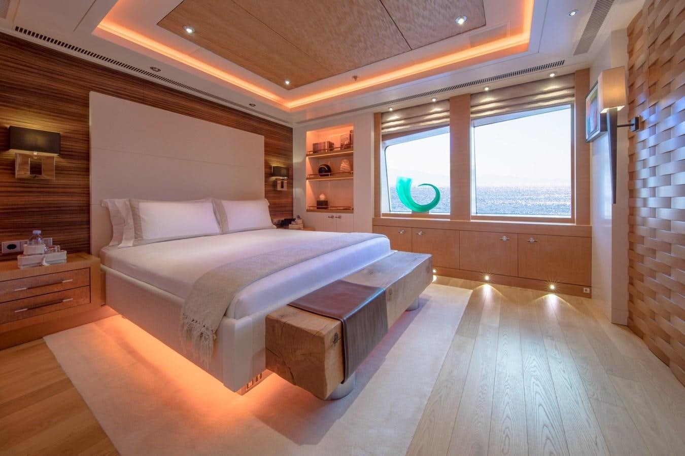 a large bedroom with a large bed aboard CAIPIRINHA Yacht for Sale