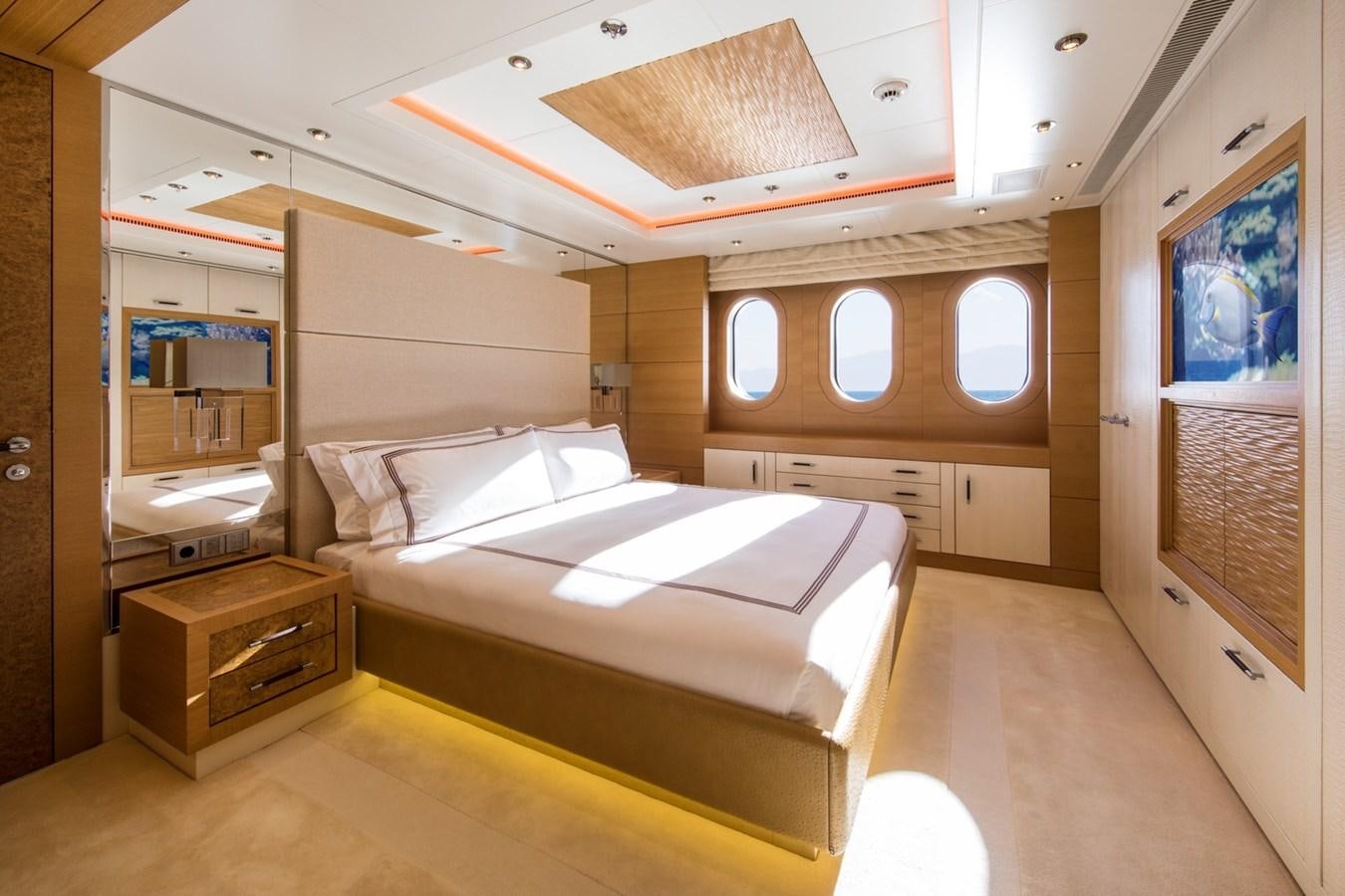 a room with a bed and a desk aboard CAIPIRINHA Yacht for Sale