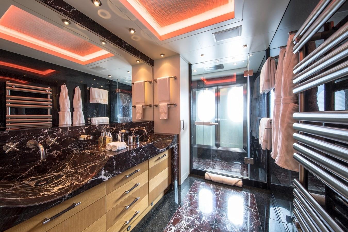 a bathroom with a marble countertop aboard CAIPIRINHA Yacht for Sale