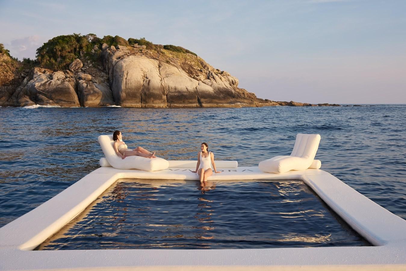 a couple of people on a boat aboard VANORA Yacht for Sale