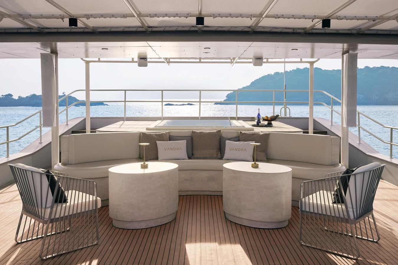a room with a couch and chairs aboard VANORA Yacht for Sale