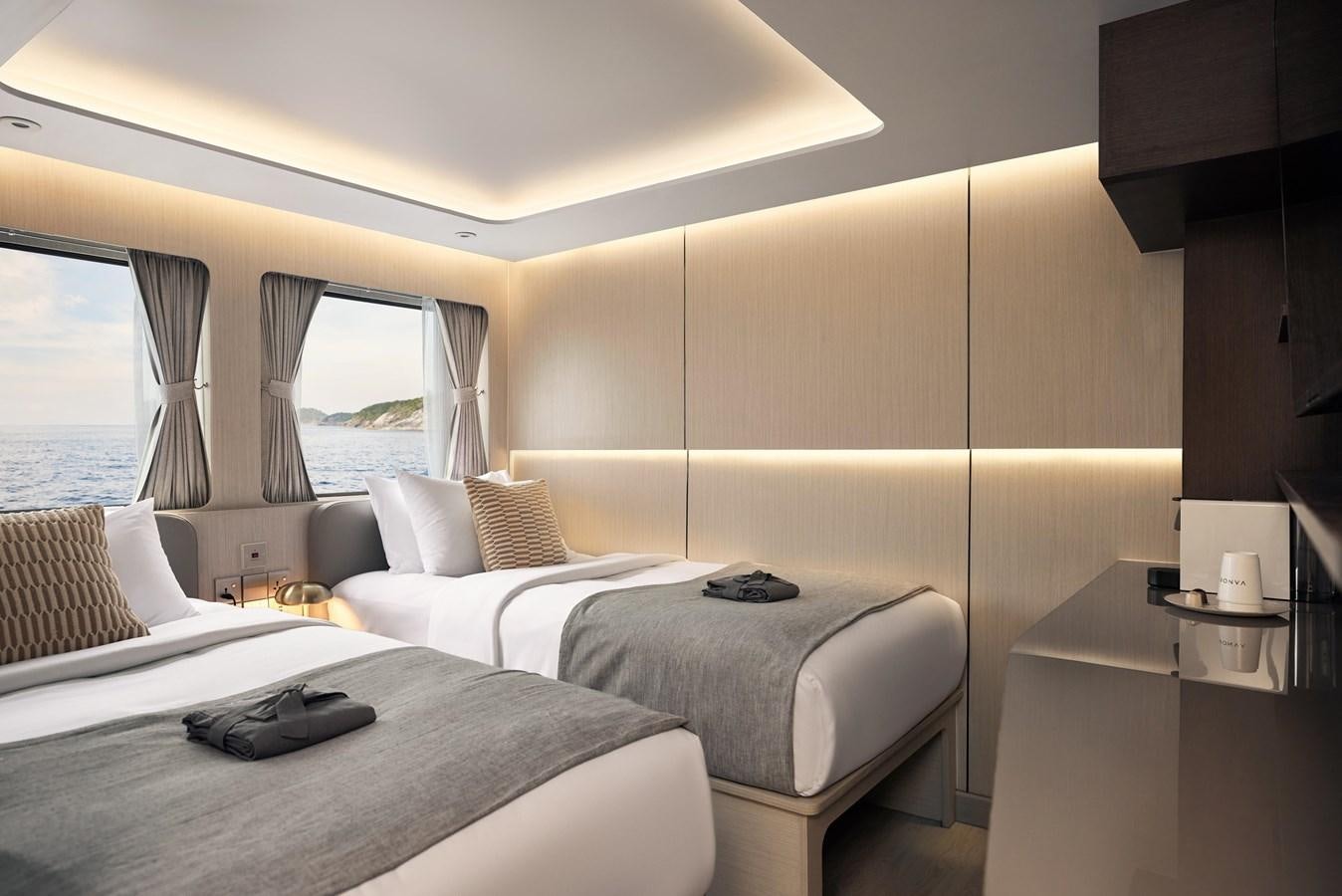a room with two beds aboard VANORA Yacht for Sale
