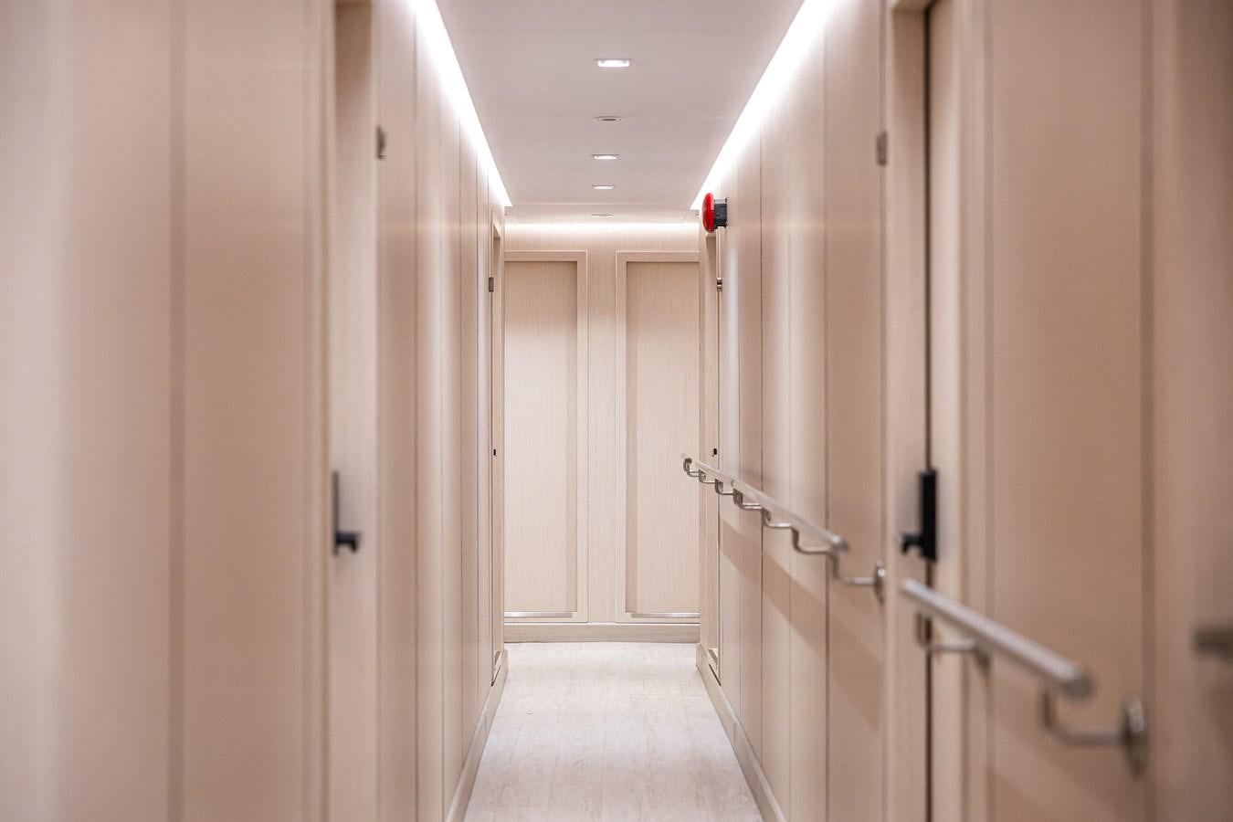 a hallway with white doors aboard VANORA Yacht for Sale