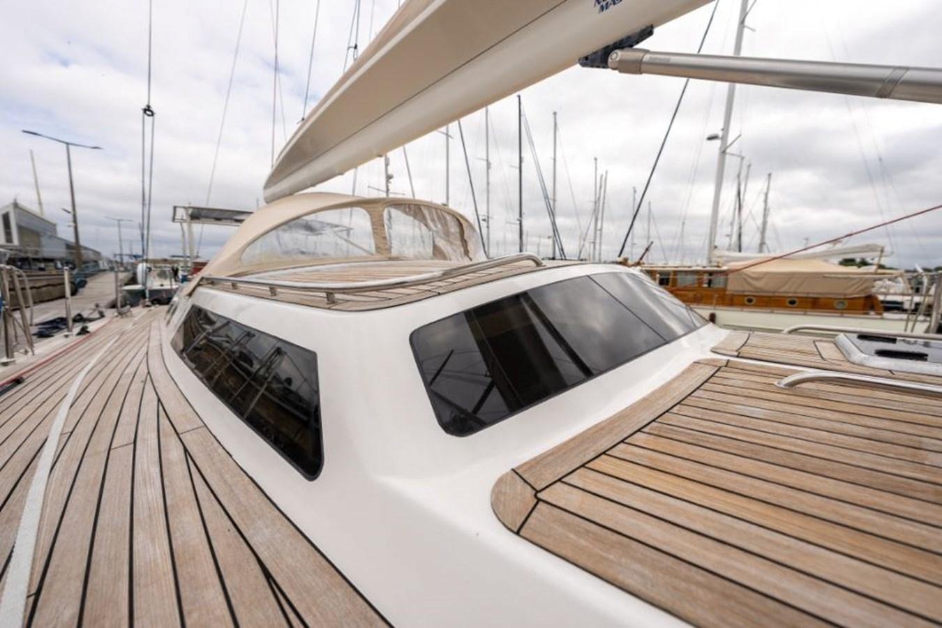 a white helicopter on a wooden deck aboard ECOVER OF SKAGEN Yacht for Sale