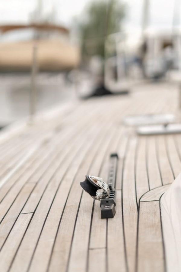 a black object on a wooden surface aboard ECOVER OF SKAGEN Yacht for Sale