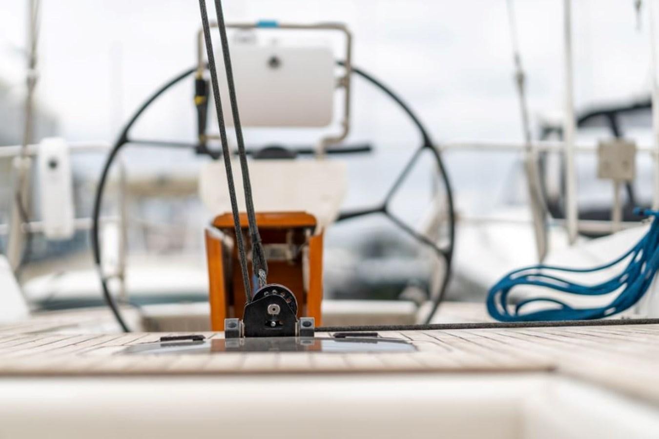 a glass cup on a table aboard ECOVER OF SKAGEN Yacht for Sale