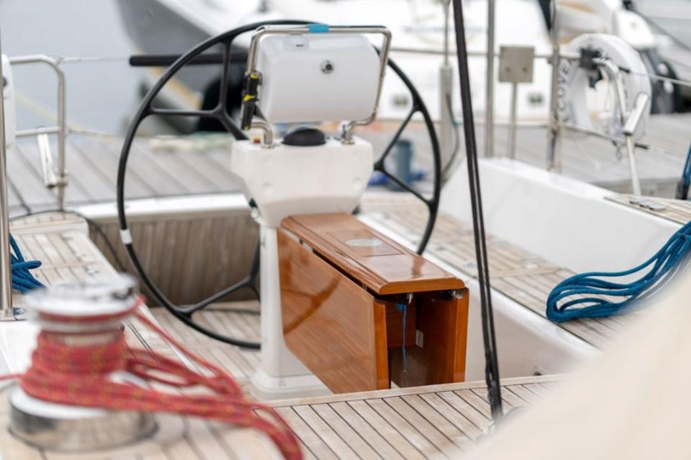 a white robot with a red tail aboard ECOVER OF SKAGEN Yacht for Sale