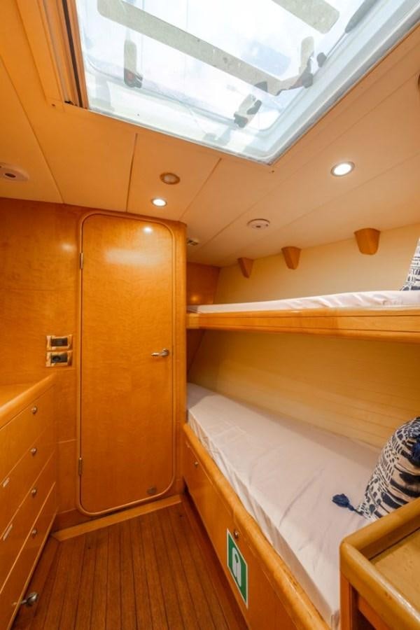 a room with a wood door and a wood cabinet aboard ECOVER OF SKAGEN Yacht for Sale