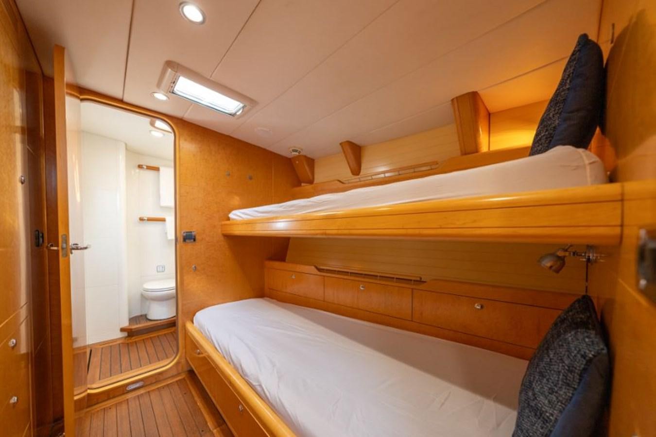 a bunk bed with a wood headboard aboard ECOVER OF SKAGEN Yacht for Sale