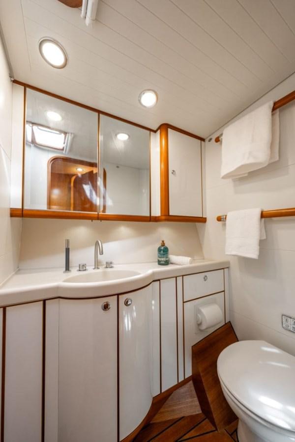 a bathroom with a mirror and a sink aboard ECOVER OF SKAGEN Yacht for Sale